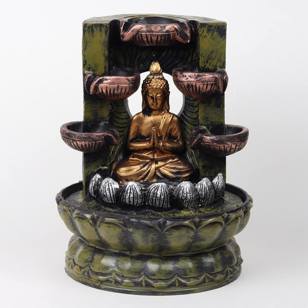 A resin table-top fountain featuring a statue of Lord Buddha, with water flowing around or from the statue.