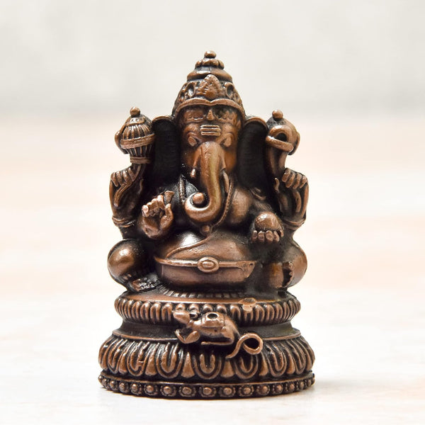 Handcrafted antique-finished copper statue of Lord Ganesha, the remover of obstacles, measuring 3L x 3W x 5H cm