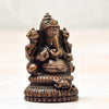 Handcrafted antique-finished copper statue of Lord Ganesha, the remover of obstacles, measuring 3L x 3W x 5H cm