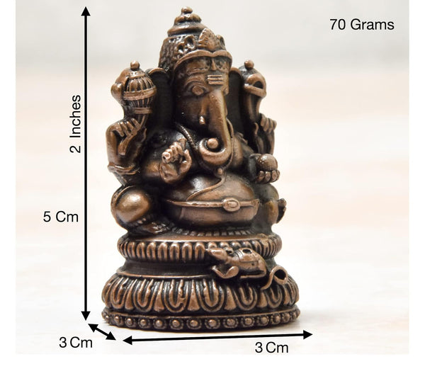 Handcrafted antique-finished copper statue of Lord Ganesha, the remover of obstacles, measuring 3L x 3W x 5H cm