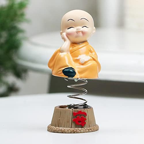 Set of four handcrafted brass baby Buddha statues, each with a serene expression, symbolizing tranquility and positive energy