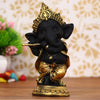 Handmade Golden and Black Polyresin Ganesha idol playing flute, intricately detailed, symbolizing wisdom and prosperity, ideal for home decor and altars