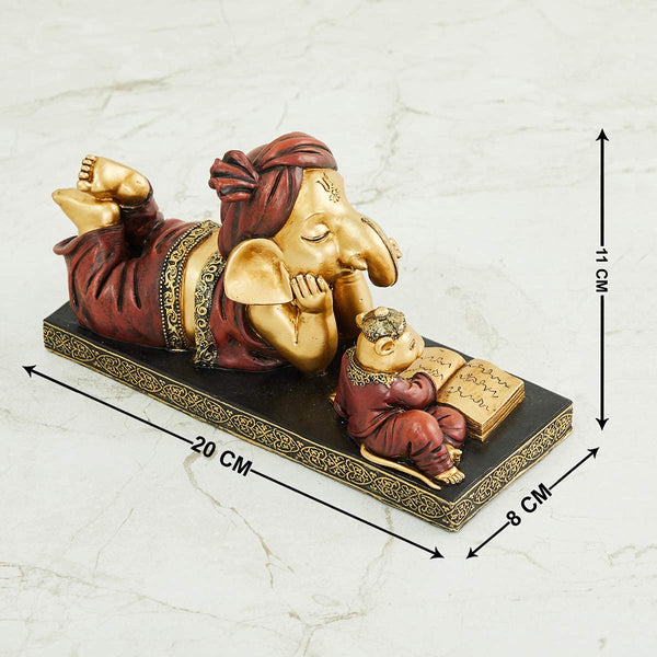 Handmade Lord Ganesh idol crafted from resin, showcasing intricate details and vibrant colors. Perfect for altars and car dashboards."