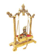 Handcrafted Krishna Jhula statue made of aluminum with golden accents, measuring 13.5L x 6.5W x 19.5H cm, symbolizing joy and devotion