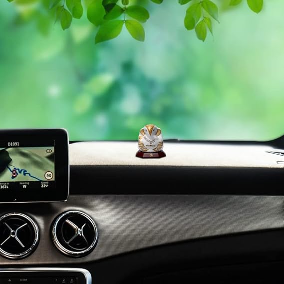 Handmade Lord Ganesh idol for car dashboard and home decor, crafted from ceramic, measuring 5.5L x 3.5W x 5.5H cm, symbolizing wisdom and prosperity