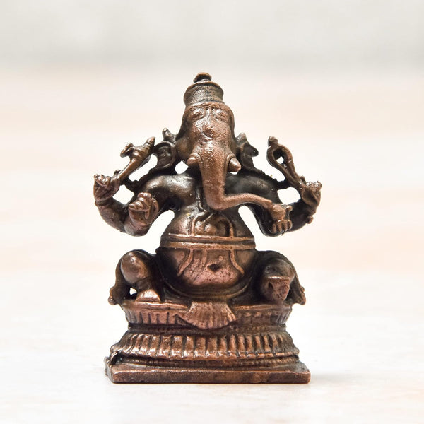 Handmade copper statue of Lord Ganesha, measuring 2.5 x 1.5 x 3.7 cm, symbolizing wisdom and prosperity, perfect for altars and home decor.