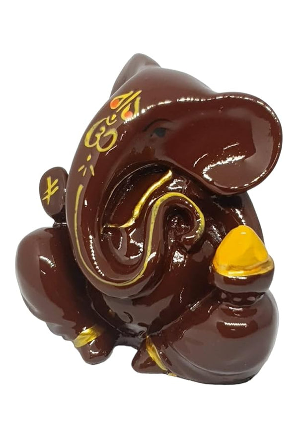 A beautifully crafted Lord Ganesha idol made of resin, showcasing intricate details and a vibrant finish. Perfect for home, office, or car dashboard decor.