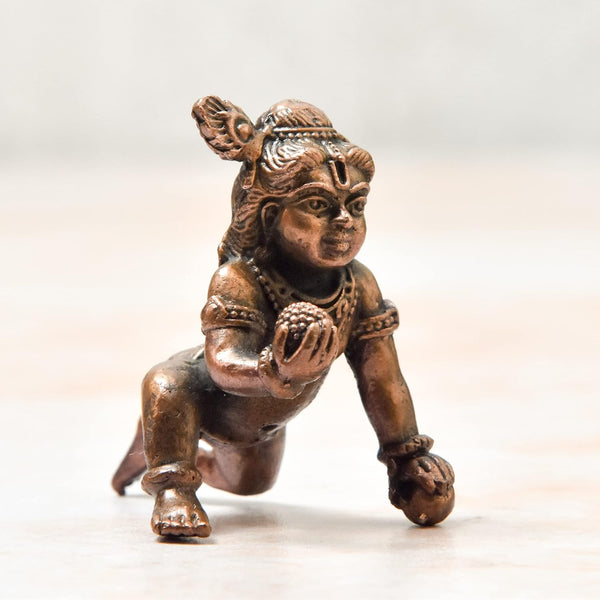 Handmade copper statue of Lord Hanuman, showcasing intricate details and craftsmanship, ideal for altars or decorative purposes.