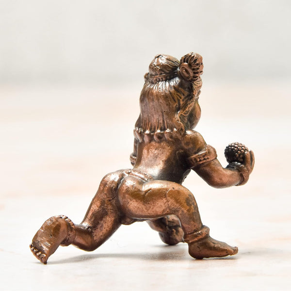 Handmade copper statue of Lord Hanuman, showcasing intricate details and craftsmanship, ideal for altars or decorative purposes.