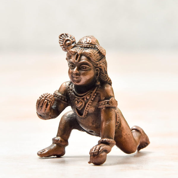 Handmade copper statue of Lord Hanuman, showcasing intricate details and craftsmanship, ideal for altars or decorative purposes.