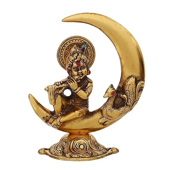 Handcrafted golden metal Lord Krishna idol, depicting him playing the flute on a half moon, showcasing intricate details and elegance.
