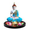 A serene Lord Buddha statue crafted from high-quality resin, featuring intricate hand-carved details and a peaceful expression, displayed with a tealight holder and decorative flower