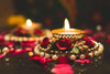 Tea Light Candle Holder and Diwali Decoration Items Traditional Designer golden Diya with Red Flowers for home décor Set of 4