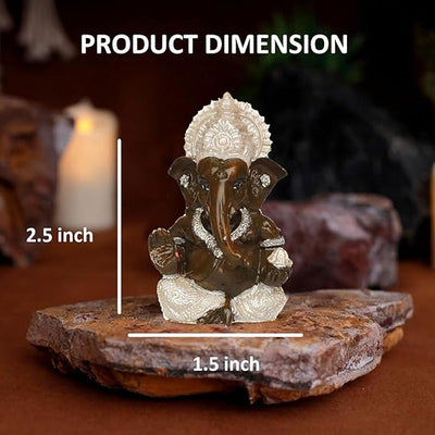 A beautifully crafted Lord Ganesha idol, made from resin with a silver-plated finish. The idol showcases intricate details and is designed for versatile placement in homes, offices,
