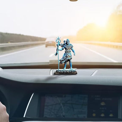 A handcrafted resin idol of Lord Shiva, standing tall with his trident and cobra. Perfect for home altars or car dashboards.