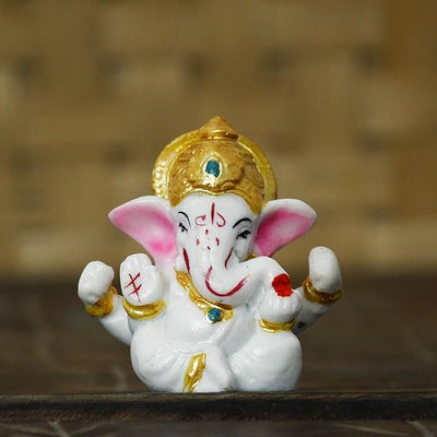 A handcrafted resin statue of Lord Ganesha, the Hindu deity known for wisdom and removing obstacles. The statue is intricately detailed and perfect for altars or home decor.