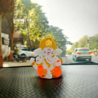 This beautiful statue of Lord Ganesha, the Hindu god of wisdom and remover of obstacles, is a perfect addition to any home or office. Crafted with exquisite detail, the idol captures the essence of the deity, making it a captivating centerpiece. Ganesha is often worshipped before undertaking new ventures, as he is believed to bring good fortune and remove any potential obstacles. 