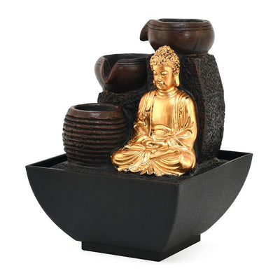 A water fountain featuring a statue of Buddha seated in meditation pose. Water flows from the Buddha's hands or from a nearby source, creating a serene and calming atmosphere. The fountain may be made of stone, marble, or other materials and may have additional decorative elements.