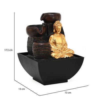 A water fountain featuring a statue of Buddha seated in meditation pose. Water flows from the Buddha's hands or from a nearby source, creating a serene and calming atmosphere. The fountain may be made of stone, marble, or other materials and may have additional decorative elements.