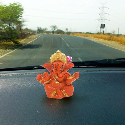 A miniature statue of Lord Ganesha, the Hindu god of wisdom and remover of obstacles.
