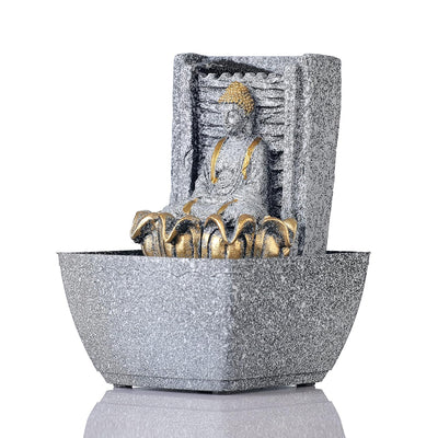 A water fountain featuring a statue of Lord Buddha, the founder of Buddhism, surrounded by cascading waterfalls or a serene pool of water. The fountain may be made of stone, marble, or other materials and may have additional decorative elements, such as plants or lights.