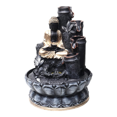 A small, tabletop fountain made of polyresin, a durable and lightweight material. Water flows through the fountain, creating a soothing sound. The fountain may have additional decorative elements, such as rocks, plants, or a figurine.