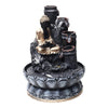 A small, tabletop fountain made of polyresin, a durable and lightweight material. Water flows through the fountain, creating a soothing sound. The fountain may have additional decorative elements, such as rocks, plants, or a figurine.
