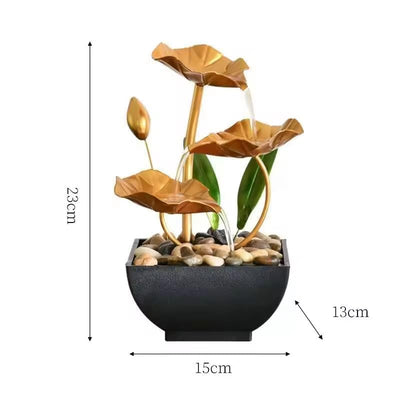 A three-tiered tabletop fountain featuring cascading waterfalls and a decorative base. The fountain may be made of ceramic, stone, or other materials and may have additional decorative elements, such as plants or lights.