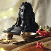Handmade Adiyogi Shiva statue with Rudraksha mala, designed for car dashboards and home altars, showcasing intricate details and craftsmanship