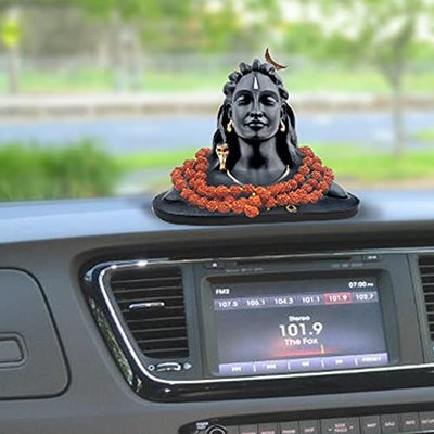 Handmade Adiyogi Shiva statue with Rudraksha mala, designed for car dashboards and home altars, showcasing intricate details and craftsmanship
