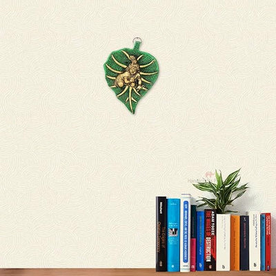 Metal Bal Krishna Leaf Wall Hanging, intricately designed to symbolize childhood innocence, ideal for home decor or altar display.