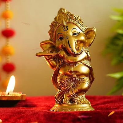 Handcrafted Ganesha statue playing a Bansuri with an integrated tealight holder, measuring 16 x 19 x 7 cm and weighing 250g. A symbol of spirituality and artistry.