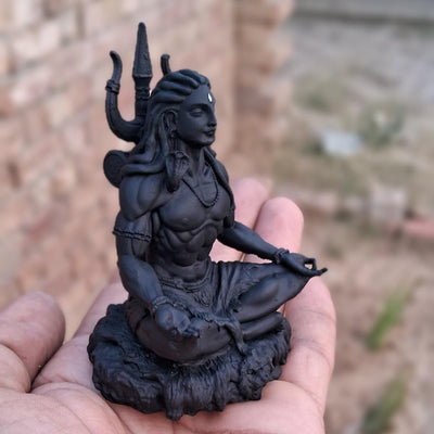 Handcrafted Black Adiyogi Shiva statue made of durable resin, showcasing intricate details, ideal for home decor and spiritual spaces.