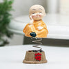 Set of four handcrafted brass baby Buddha statues, each with a serene expression, symbolizing tranquility and positive energy