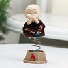 Set of four handcrafted brass baby Buddha statues, each with a serene expression, symbolizing tranquility and positive energy
