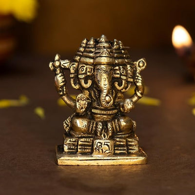"Handmade brass Ganesha idol measuring 6 cm x 3 cm x 7 cm, symbolizing wisdom and prosperity, ideal for home decor and altars."