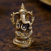 Handcrafted 100% brass Ganesha idol, measuring 4.8L x 3.8W x 6.8H cm, perfect for home altar or car dashboard, symbolizing prosperity and wisdom.