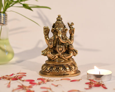  Handmade brass Ganesha idol, ideal for pooja room or as a collectible. Dimensions: 5.6L x 6.1W x 10.2H cm, 460 grams.