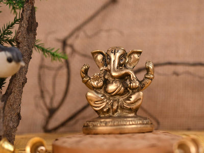 Handmade brass Ganesha idol, ideal for pooja room or as a collectible. Dimensions: 5L x 4W x 6H cm, 280 grams.