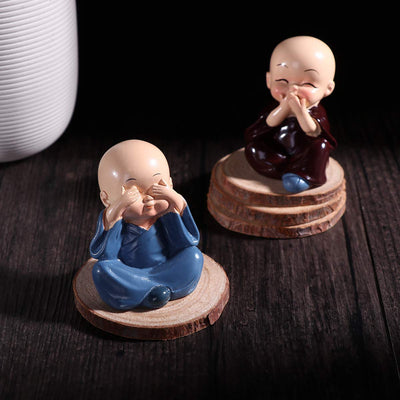 Set of 4 multicolor handcrafted resin Buddha monk statues, each uniquely designed to enhance home decor and create a tranquil ambiance.