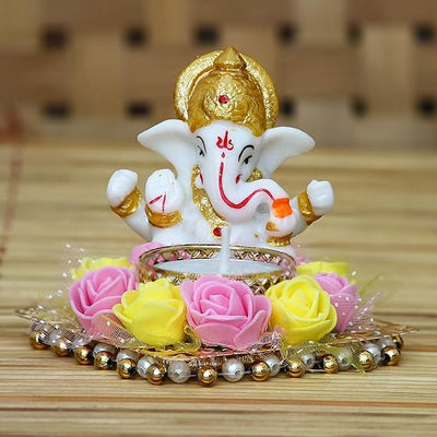 Charming Lord Ganesha idol made of resin, dimensions 10 cm x 10 cm x 7 cm, symbolizing wisdom and prosperity, ideal for home and office decor.