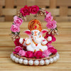 Captivating Lord Ganesha idol on a floral throne, dimensions 9x9x9.5 cm, weighing 200 grams, crafted from high-quality resin.