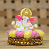 Handcrafted Lord Ganesha idol made of vibrant resin, measuring 8x8x8 cm, symbolizing prosperity and wisdom, placed on a decorative plate.