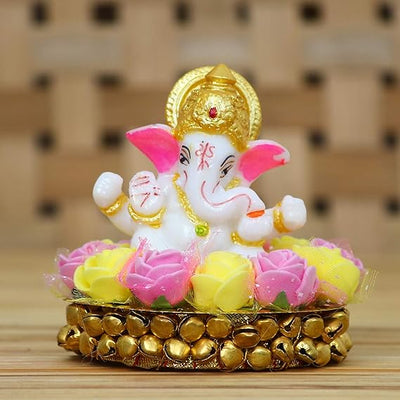 Handcrafted Lord Ganesha idol made of vibrant resin, measuring 8x8x8 cm, symbolizing prosperity and wisdom, placed on a decorative plate.