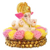 Handcrafted Lord Ganesha idol made of vibrant resin, measuring 8x8x8 cm, symbolizing prosperity and wisdom, placed on a decorative plate.