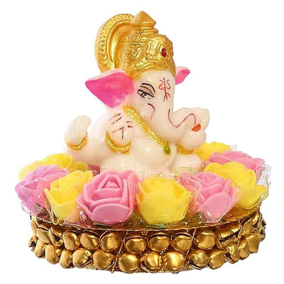 Handcrafted Lord Ganesha idol made of vibrant resin, measuring 8x8x8 cm, symbolizing prosperity and wisdom, placed on a decorative plate.