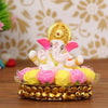 Handcrafted Lord Ganesha idol made of vibrant resin, measuring 8x8x8 cm, symbolizing prosperity and wisdom, placed on a decorative plate.