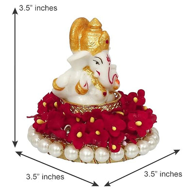 Elegant Lord Ganesha idol made of resin, measuring 8.9 cm x 8.9 cm x 8.9 cm, symbolizing prosperity and wisdom, ideal for home and car decor.