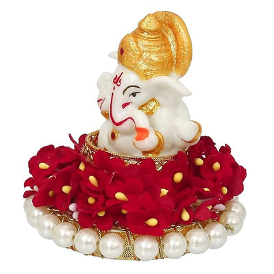 Elegant Lord Ganesha idol made of resin, measuring 8.9 cm x 8.9 cm x 8.9 cm, symbolizing prosperity and wisdom, ideal for home and car decor.