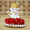 Elegant Lord Ganesha idol made of resin, measuring 8.9 cm x 8.9 cm x 8.9 cm, symbolizing prosperity and wisdom, ideal for home and car decor.